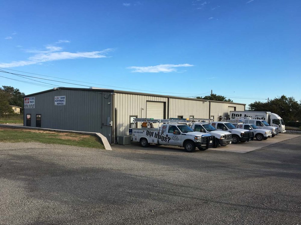 ACI service trucks parked beside the office