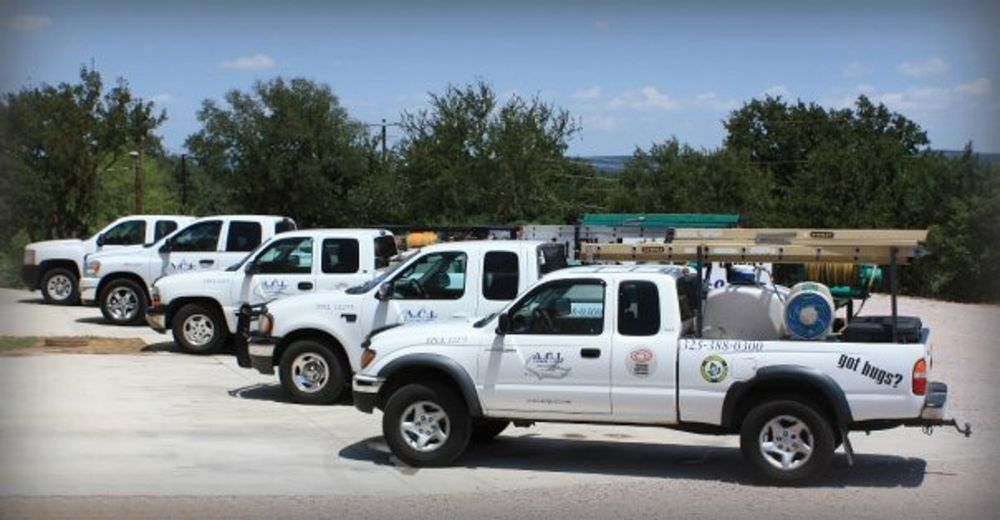 Row of ACI pickup trucks parked at the shop