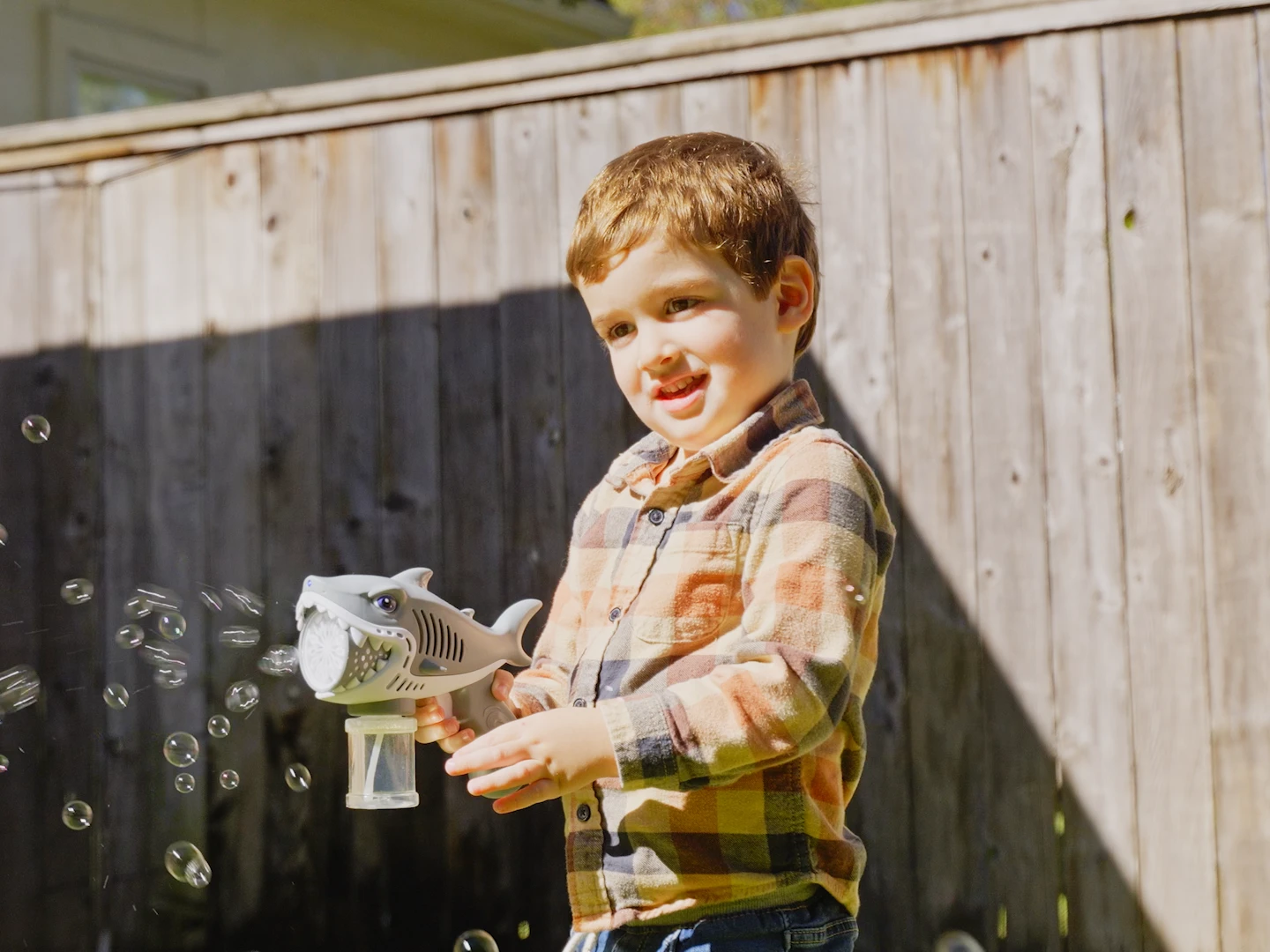 A child playing in a treated back yard