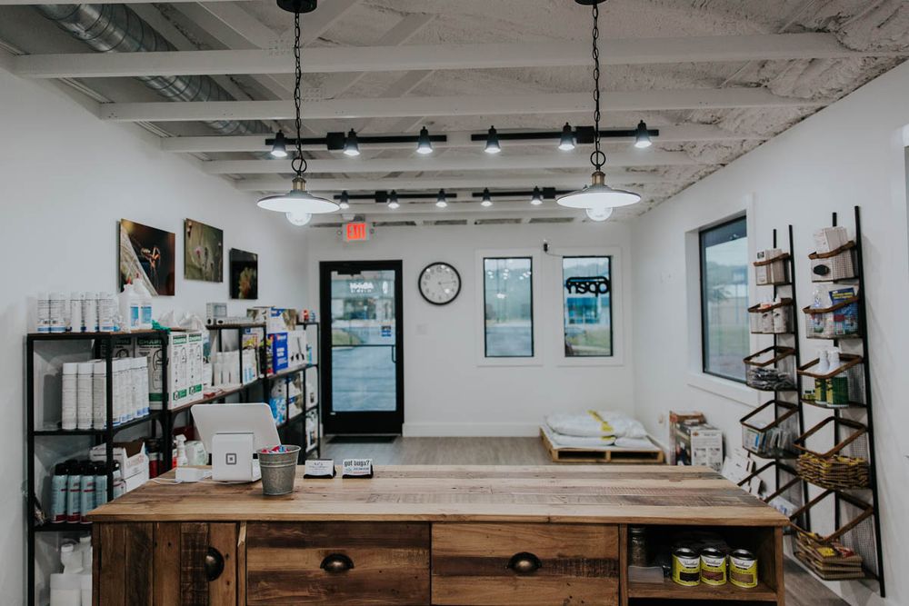 Wooden retail counter and product shelves inside the ACI office