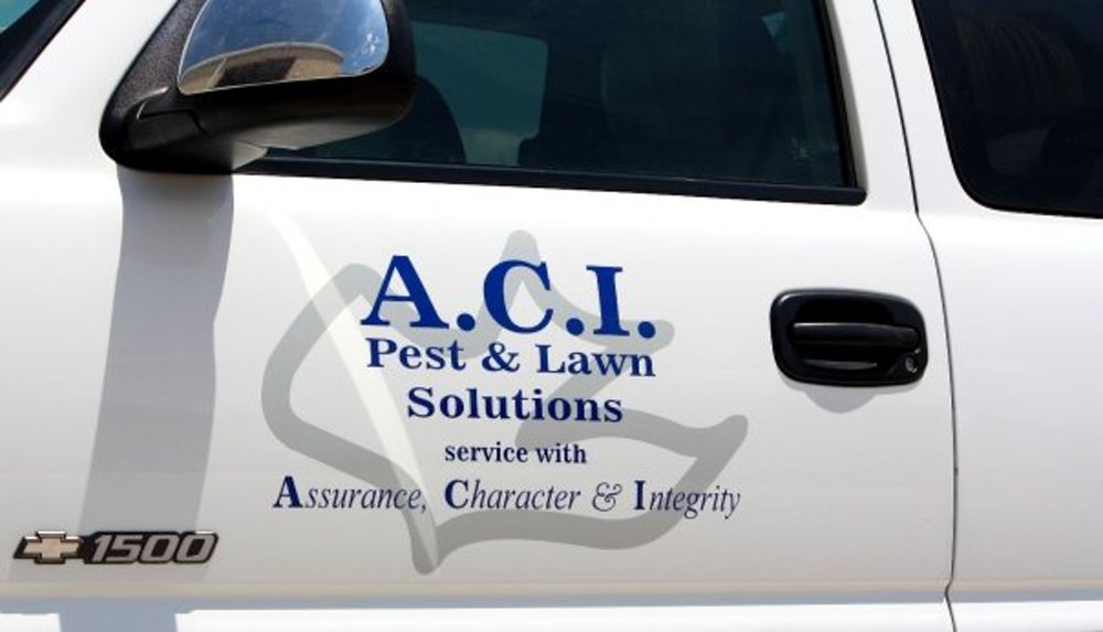 Close-up of the ACI logo on a truck door